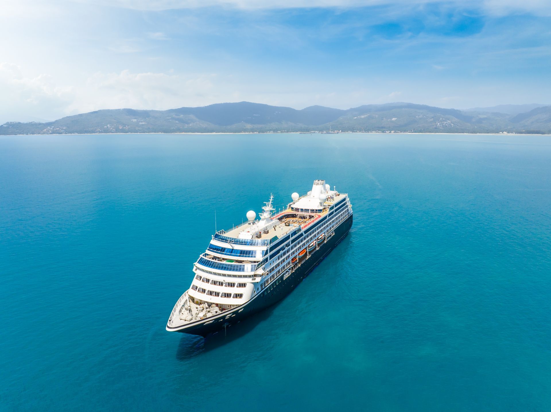 An aerial view of a cruise ship in the ocean.