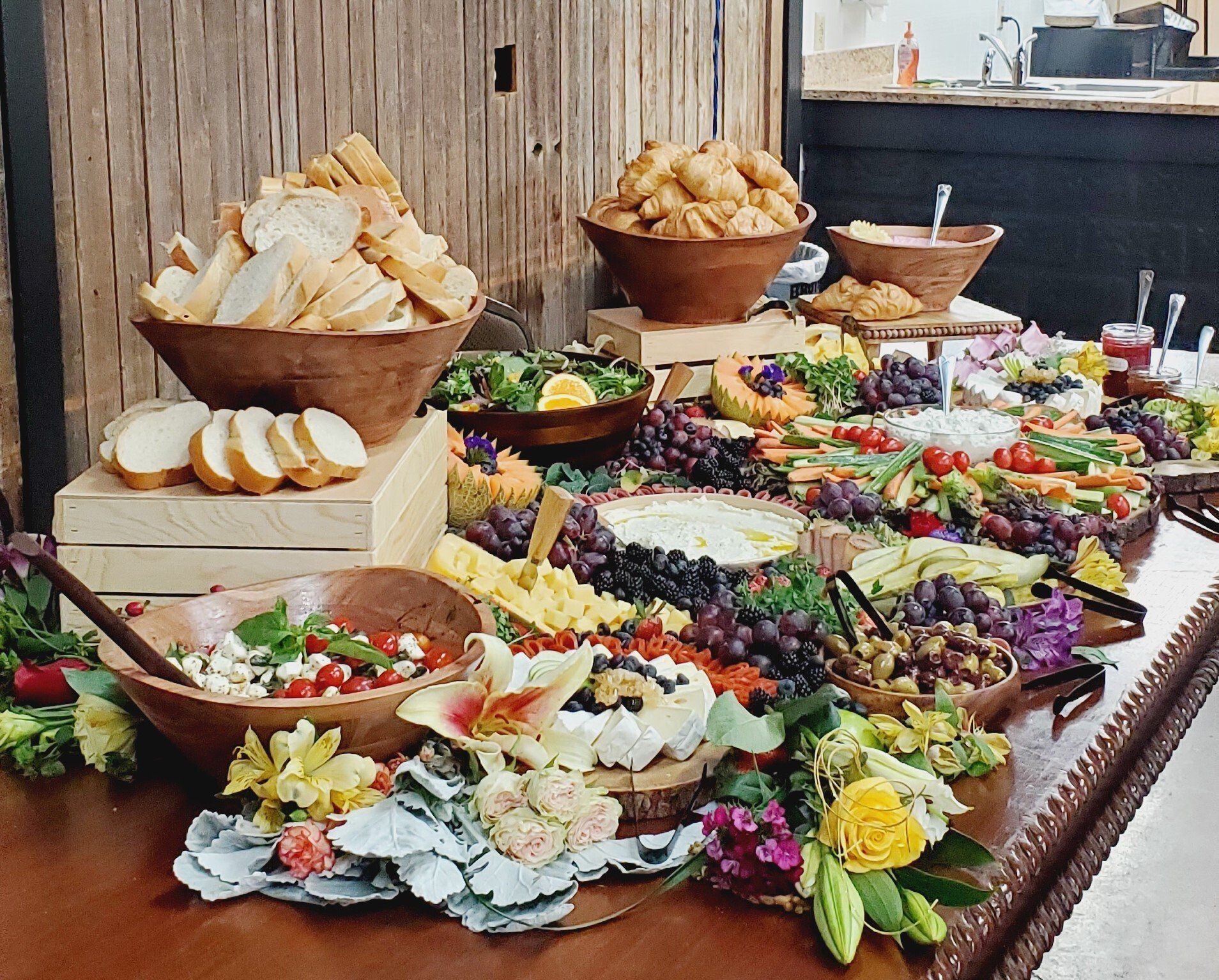 A buffet table filled with lots of different types of food.