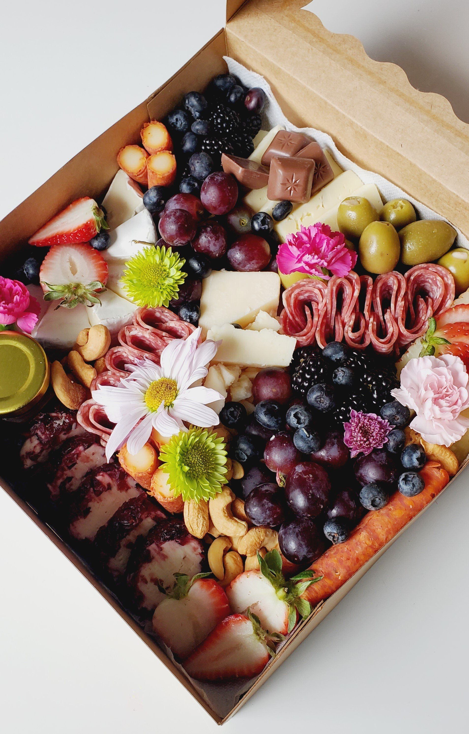 A box filled with a variety of fruits and vegetables.