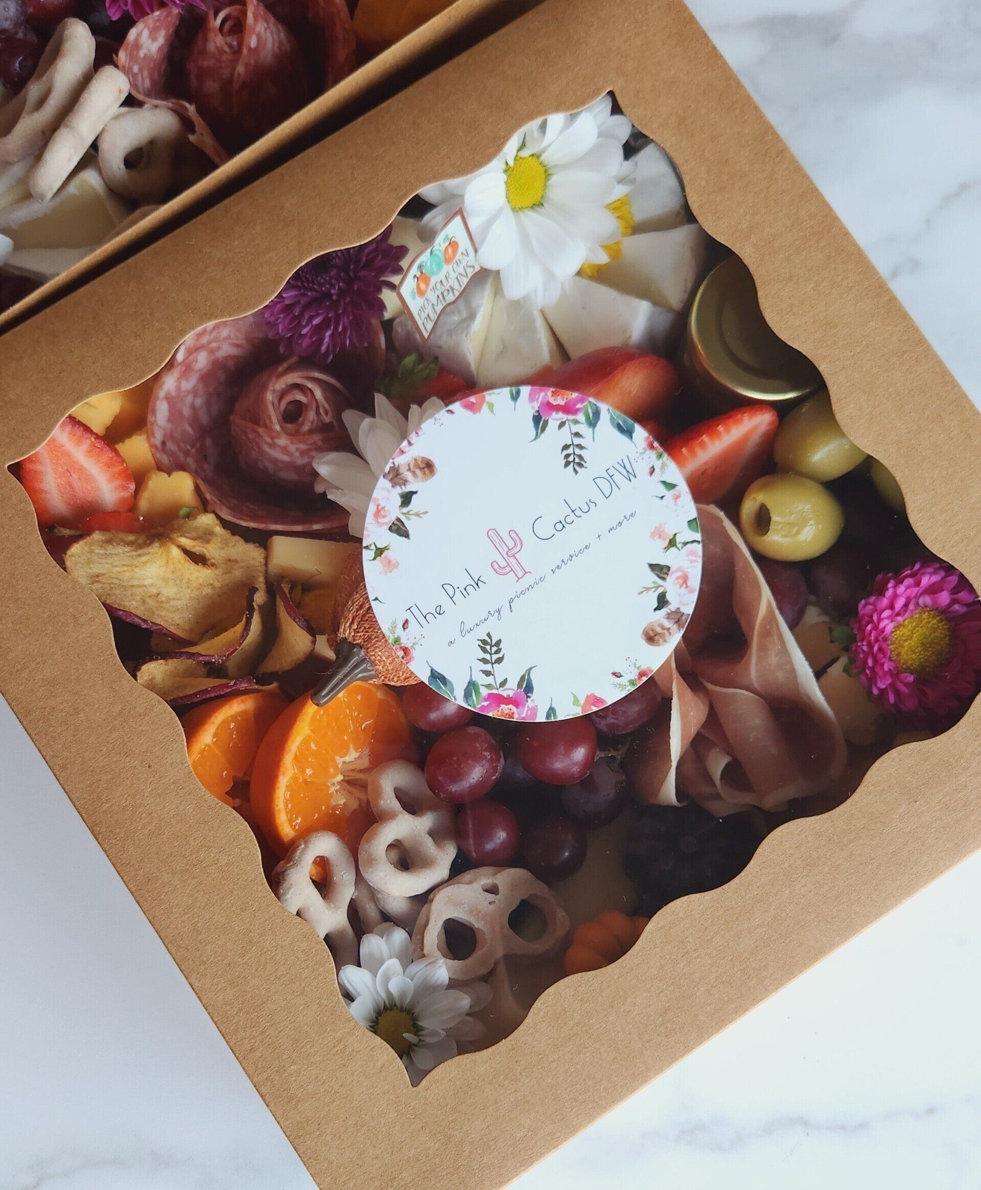 A box of food with a sticker that says ' delicious ' on it