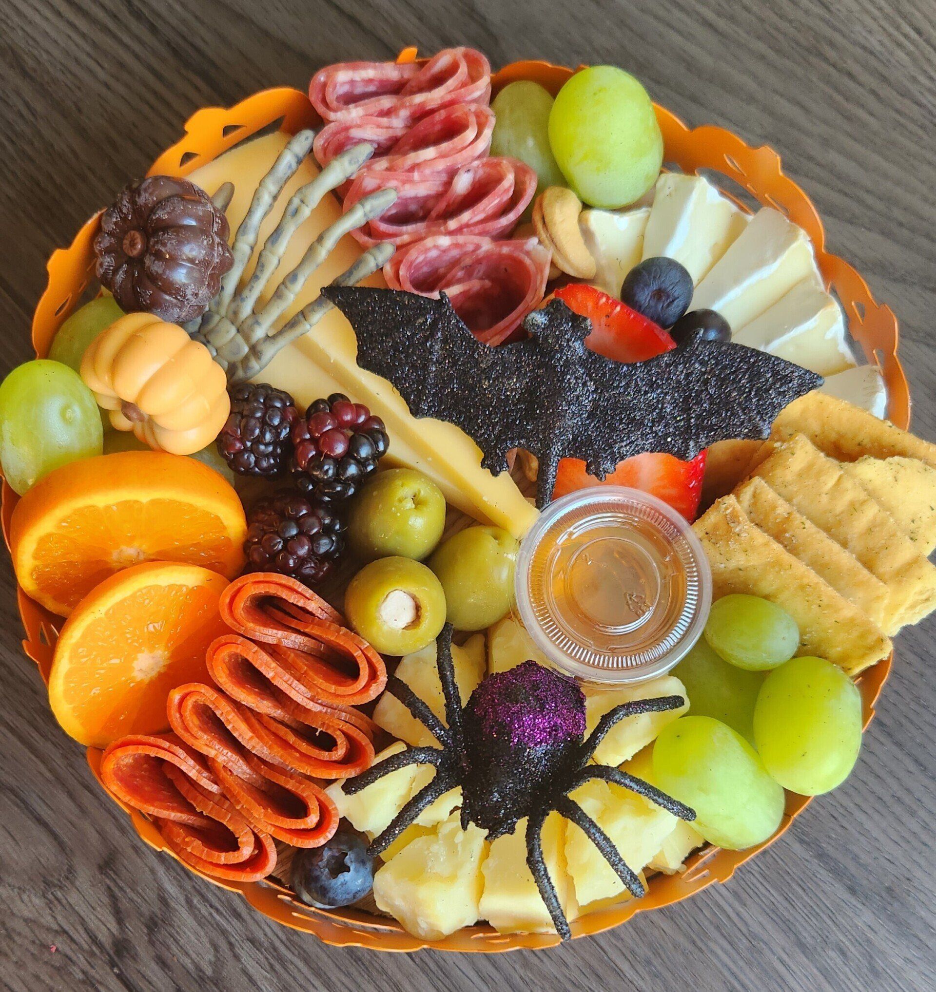 A tray of food with a spider and a bat on it.