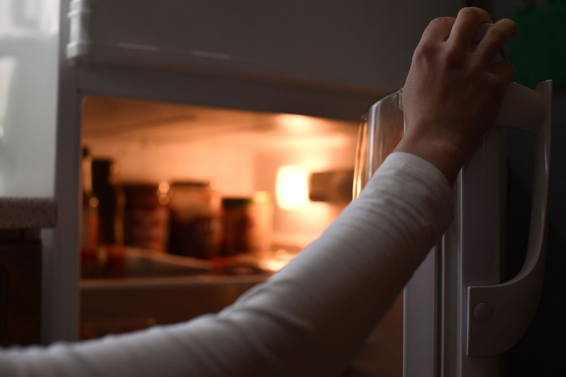 Female Hand Opens Fridge — Geelong, VIC — Cool Cats Refrigeration