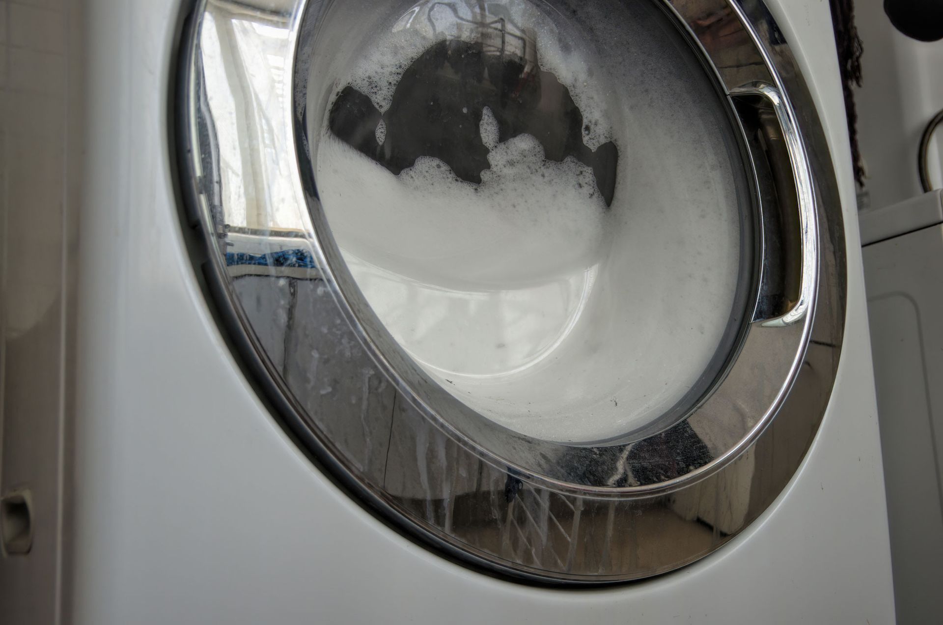 Front Loading Washing Machine with Too Many Suds Inside It — Geelong, VIC — Cool Cats Refrigeration