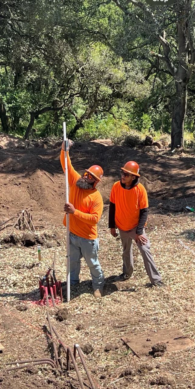 Two Construction Workers Are Holding a Pole | Walnut Creek, CA | B&B Excavation