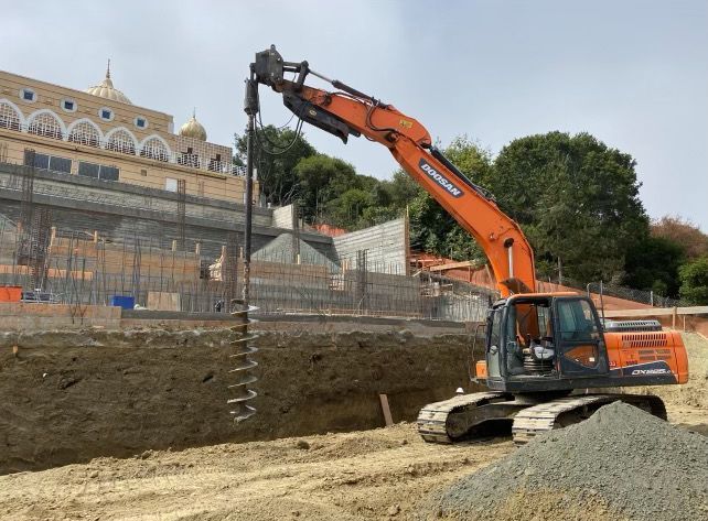A Large Orange Excavator Is Working on A Construction Site | Walnut Creek, CA | B&B Excavation
