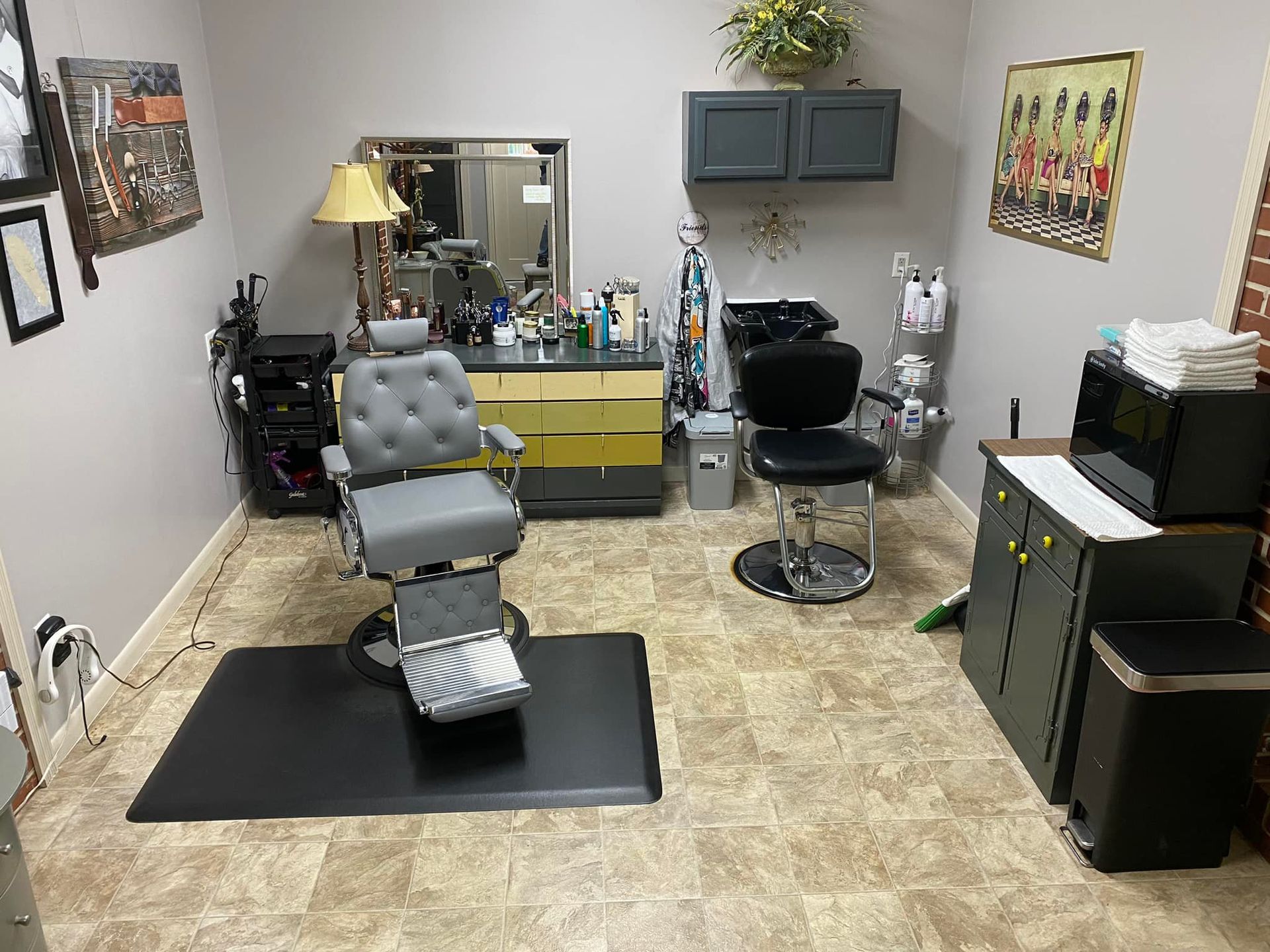 There is a barber chair in the middle of the room.