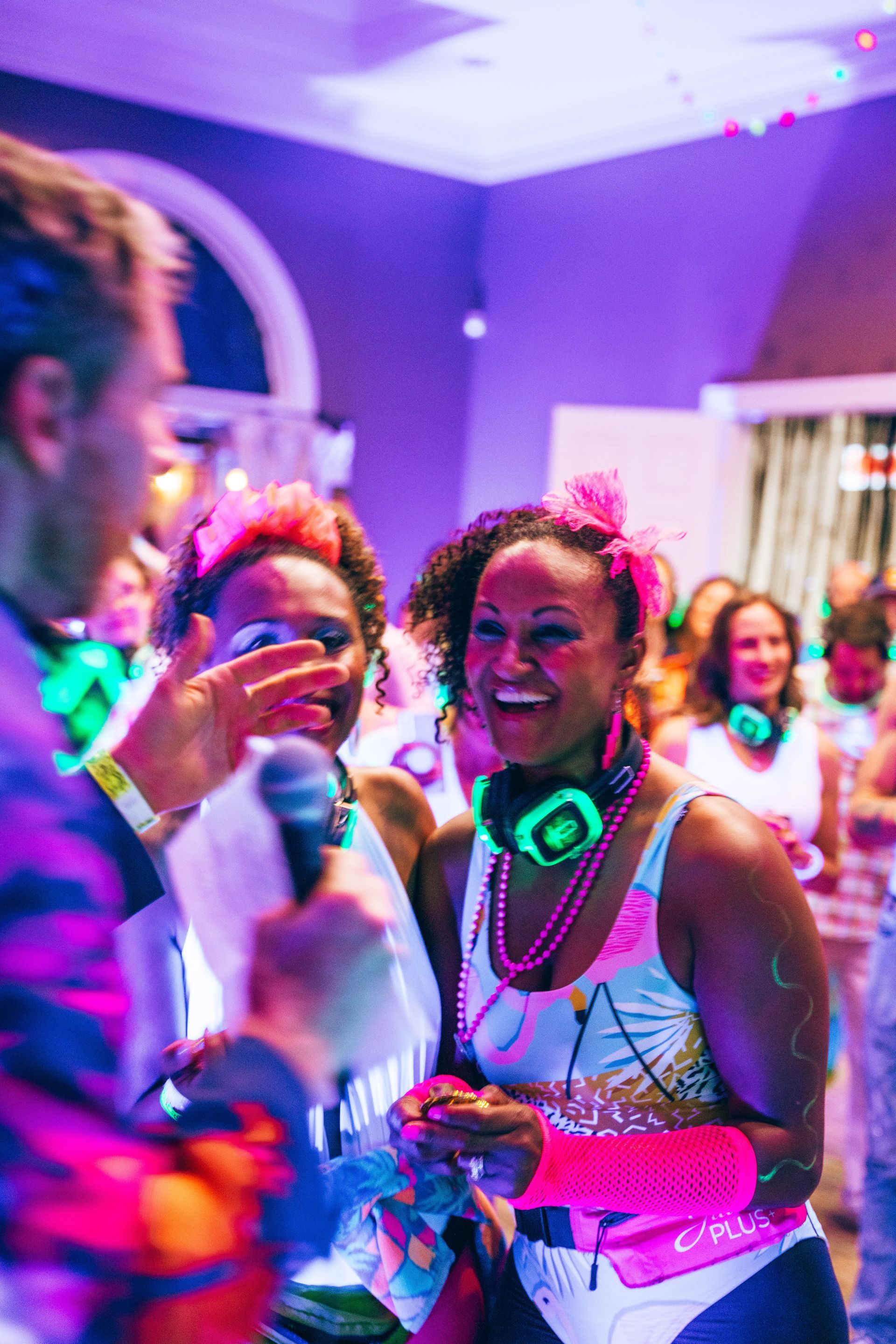 People dancing in a room to silent disco