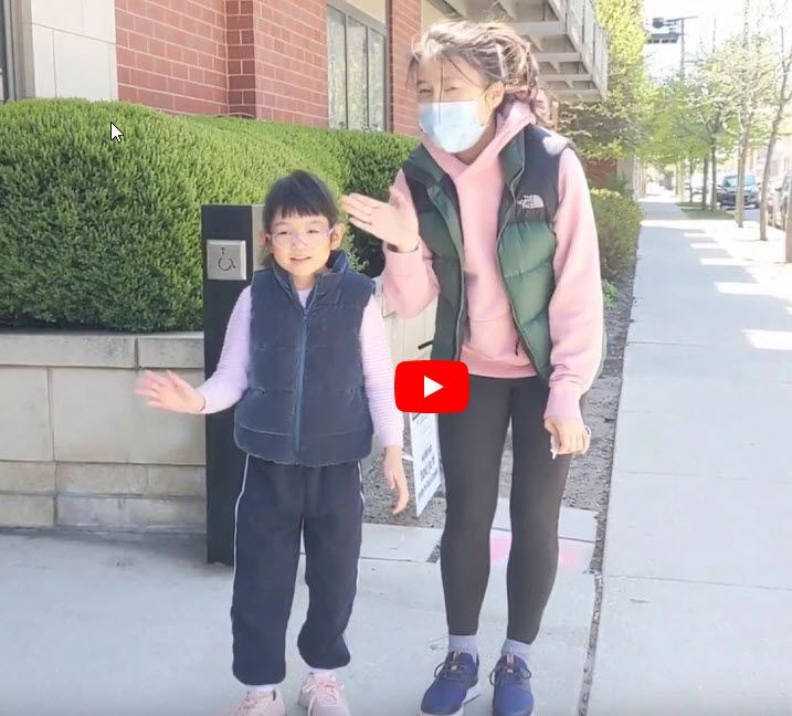 Mom and KEEN Athlete waving from sidewalk