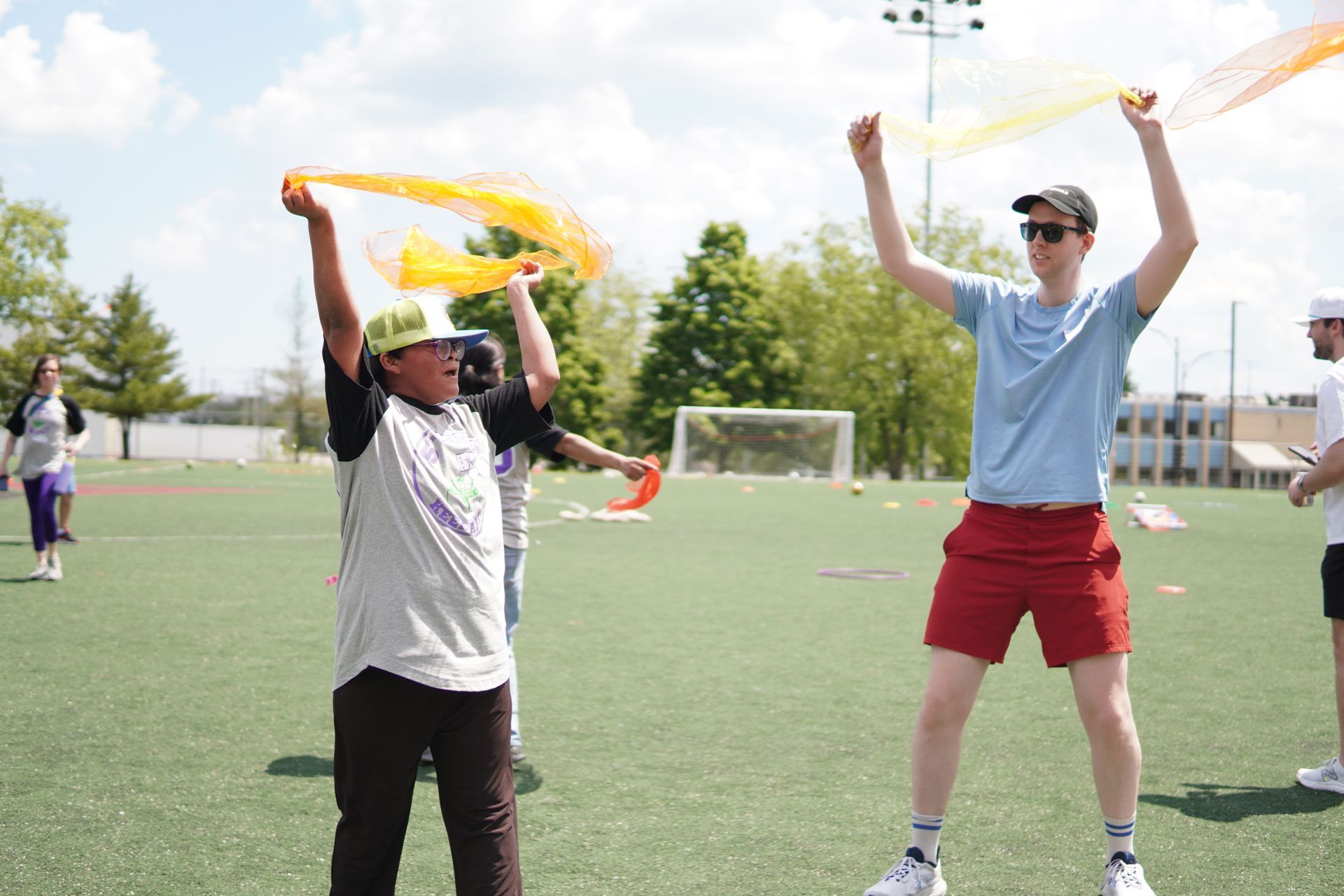 Two event attendees dance together