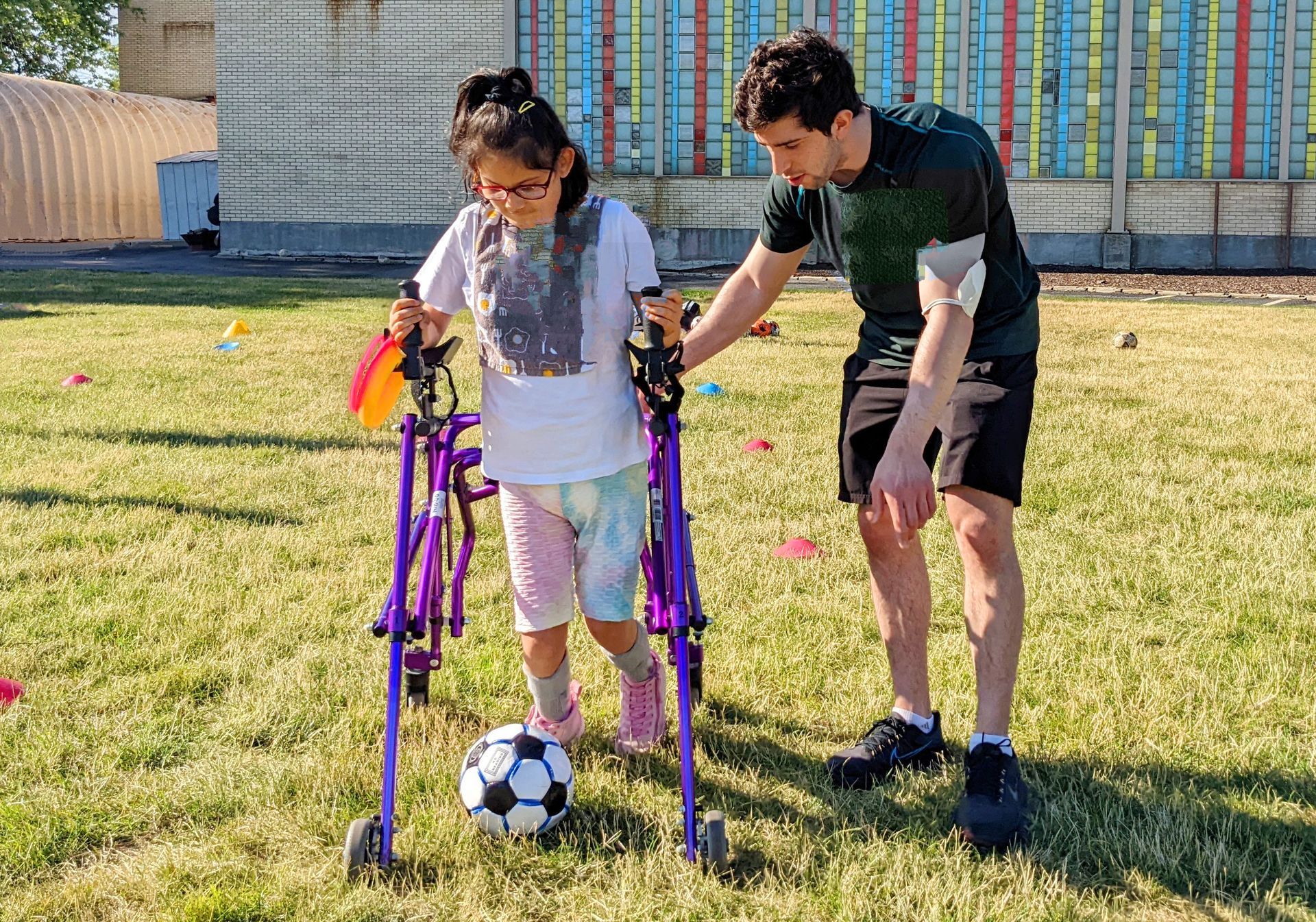 KEEN Chicago Athlete and Volunteer with soccer ball