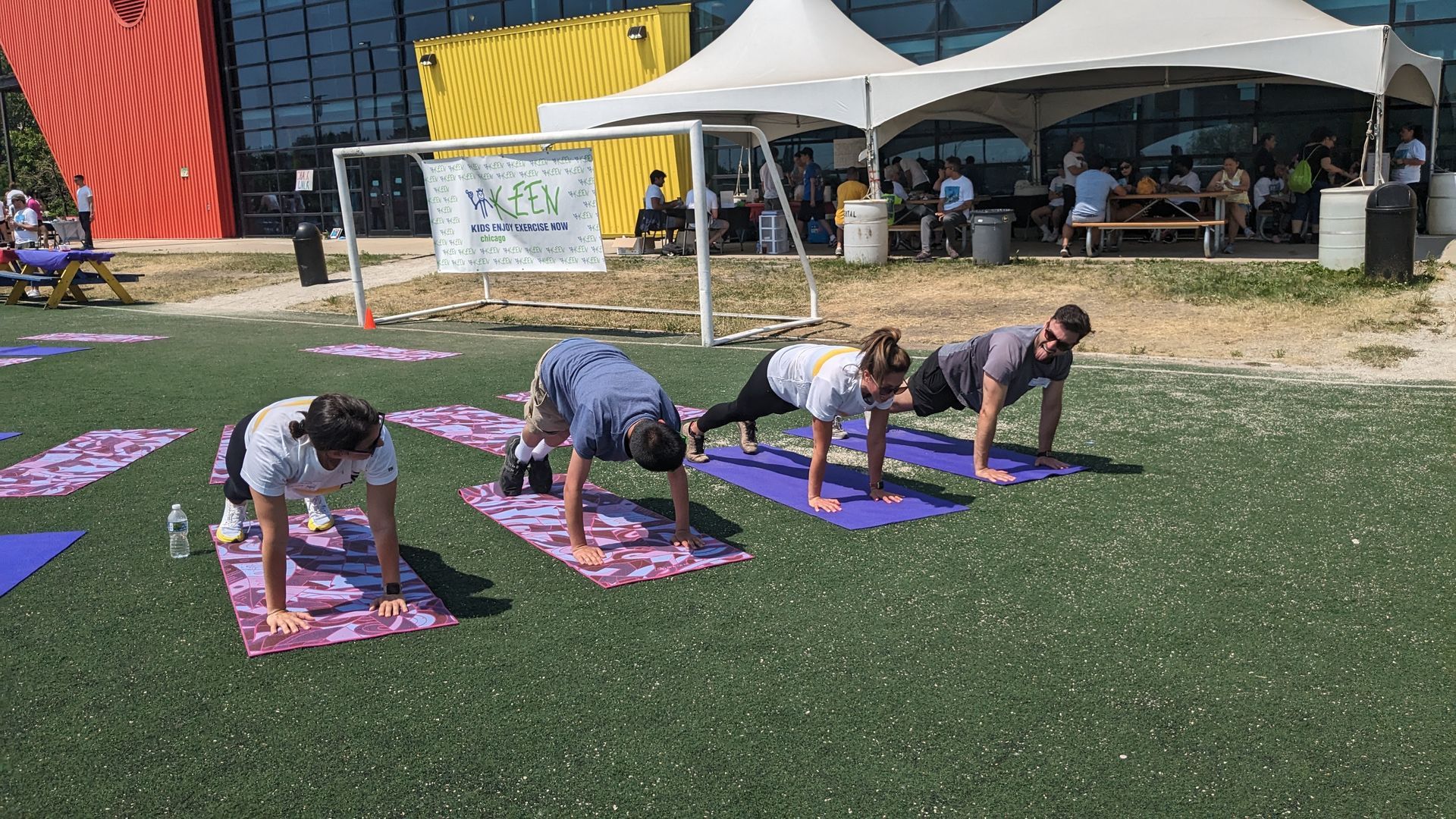 4 attendees do yoga together