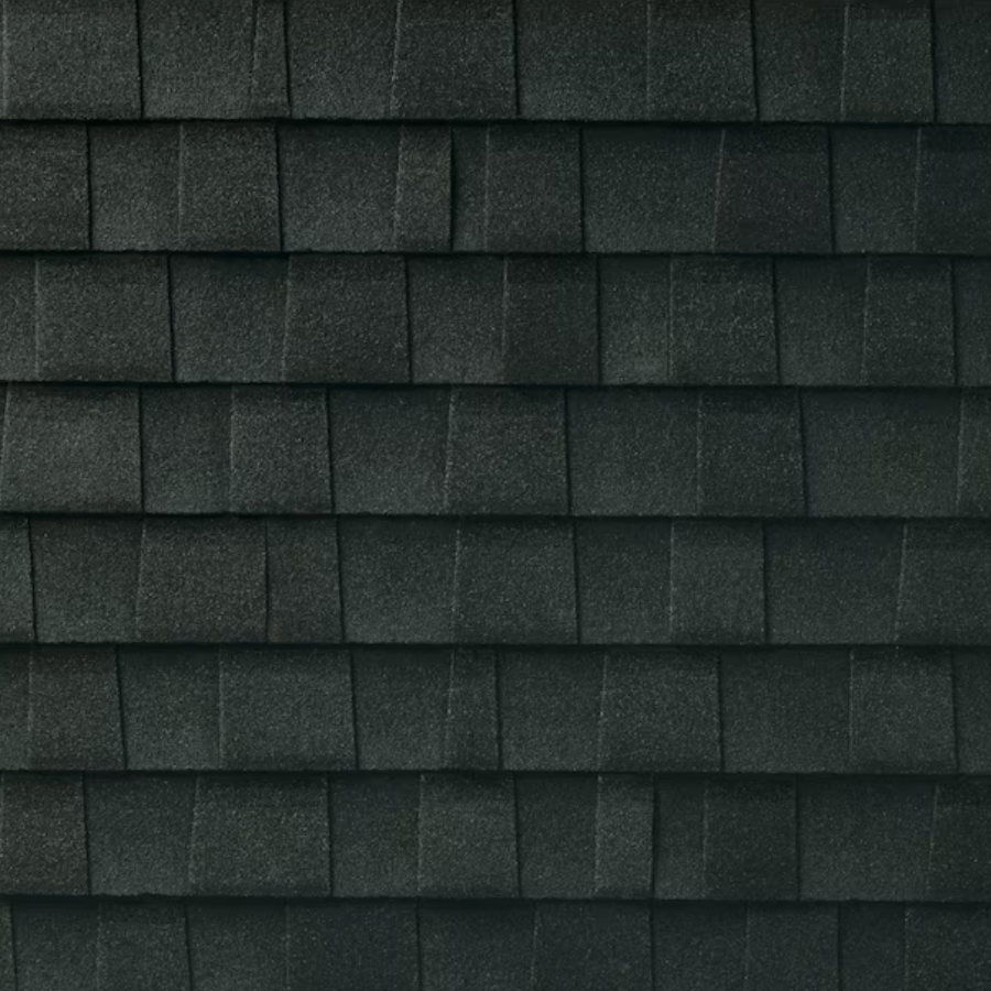 Close-up of black asphalt roof shingles with textured surface.
