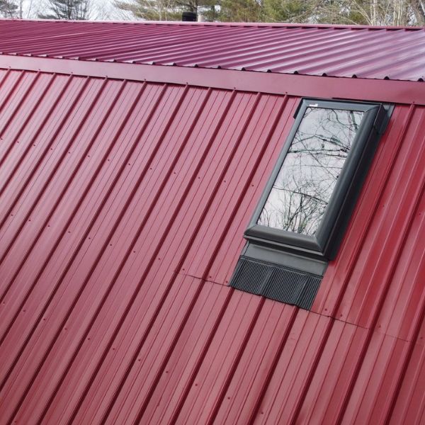 Red metal roof with skylight.
