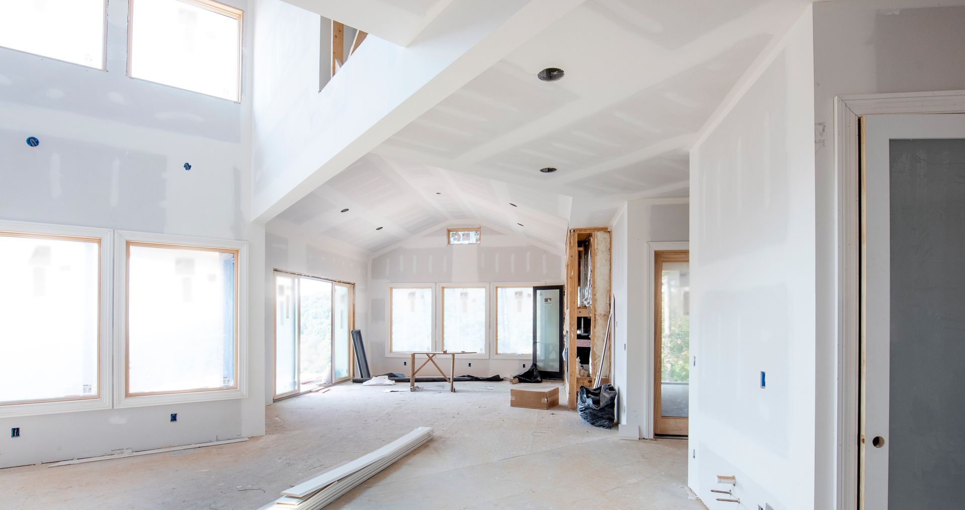 A large empty room in a house under construction.