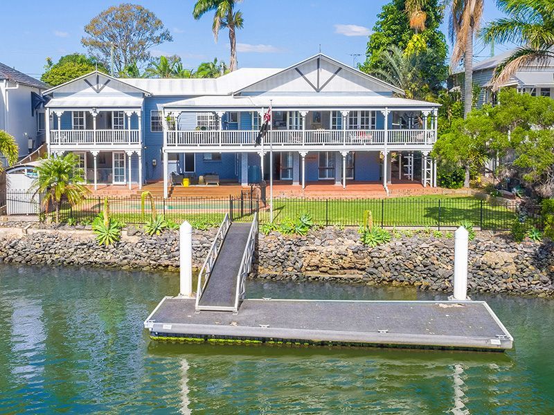 A large house with a dock in front of it.