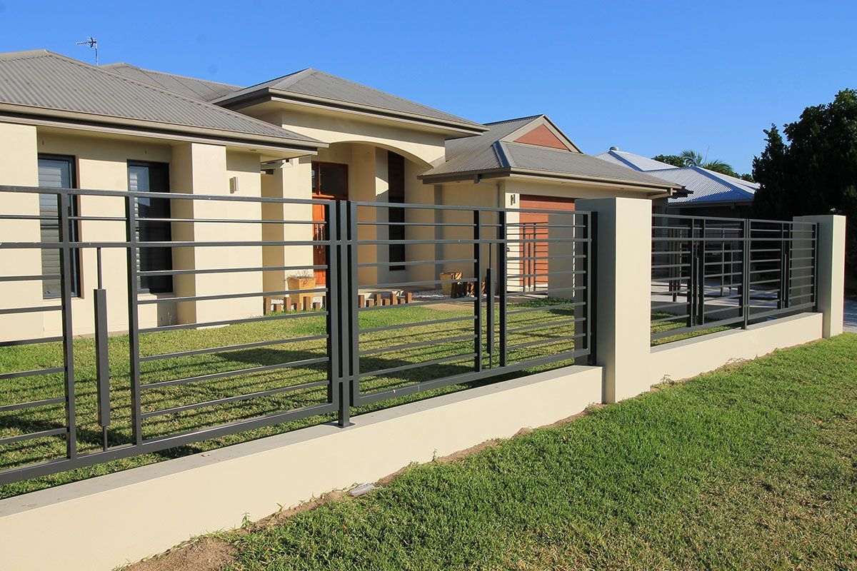 A house with a fence in front of it