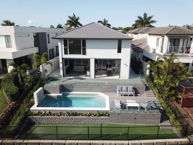 An aerial view of a house with a swimming pool