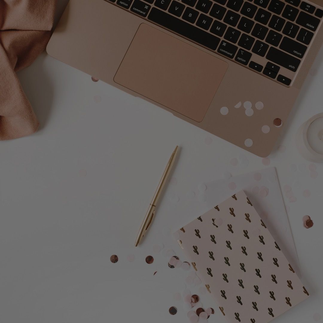 computer and notebook on desk
