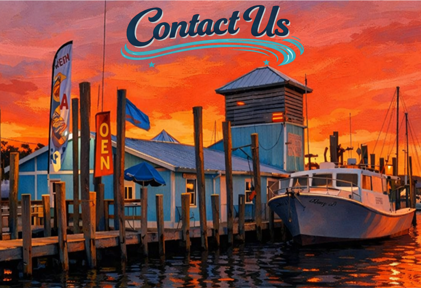 A waterfront restaurant at sunset with a boat docked. 