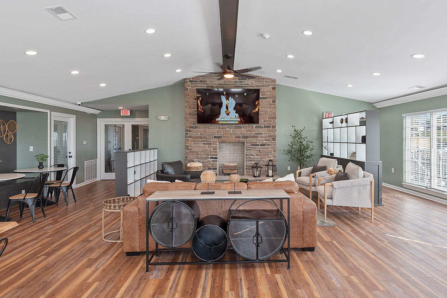 Spacious clubhouse lounge at Bridgewater Crossing with modern seating and large windows.