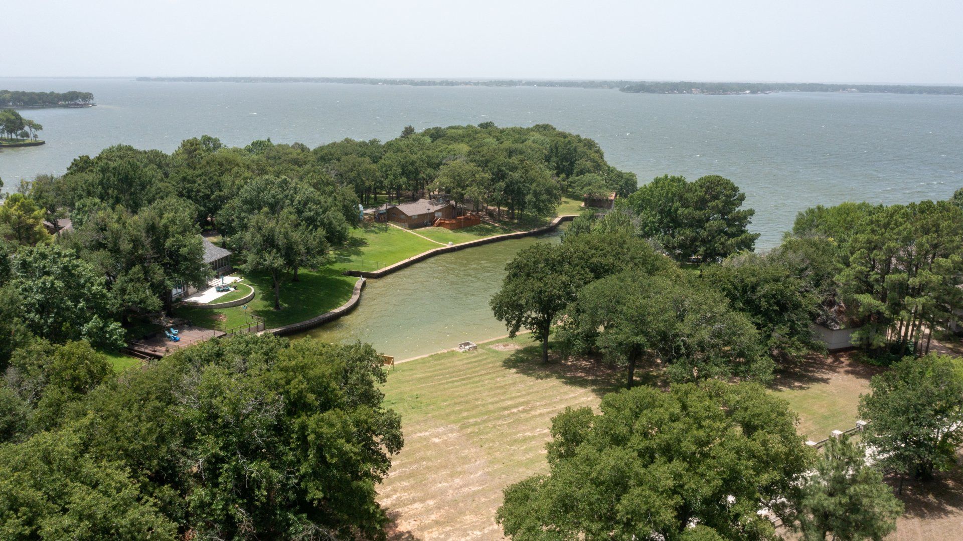 An aerial view of a small island in the middle of a body of water