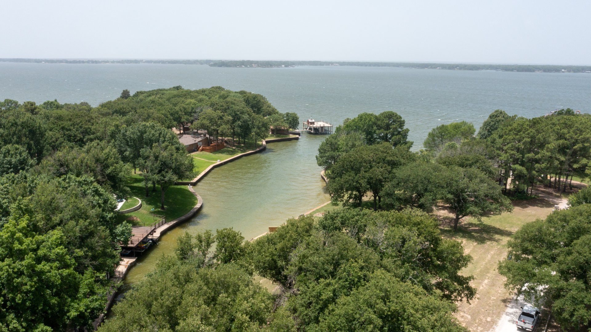 An aerial view of a large body of water surrounded by trees