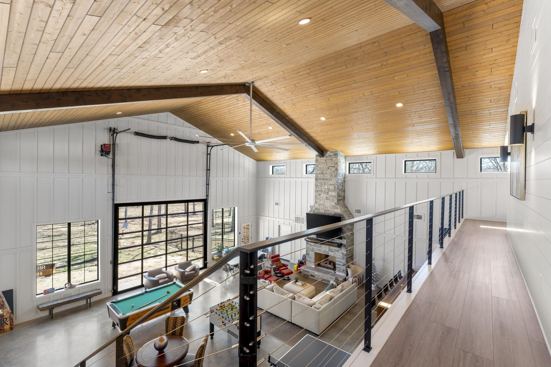 There is a pool table in the middle of the room.