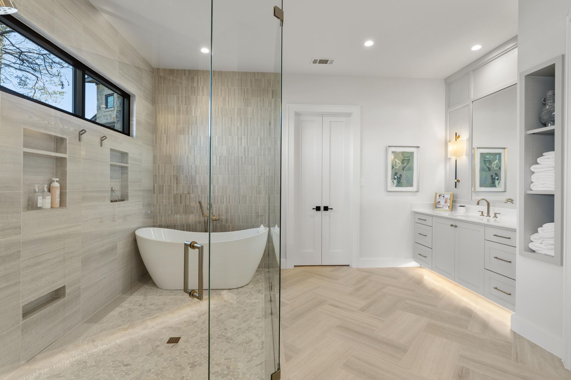 A bathroom with a bathtub and a walk in shower.