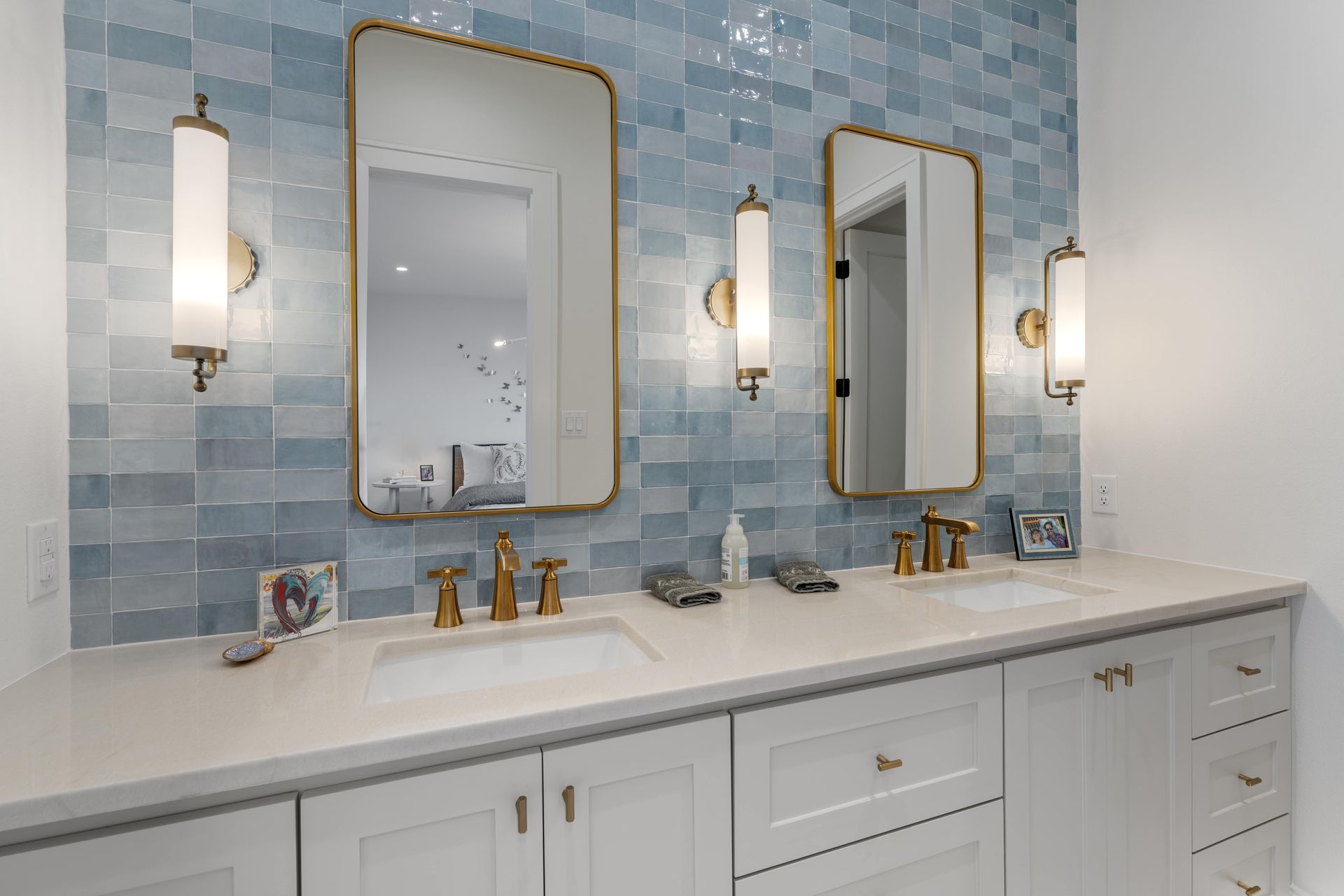 A bathroom with two sinks and two mirrors.