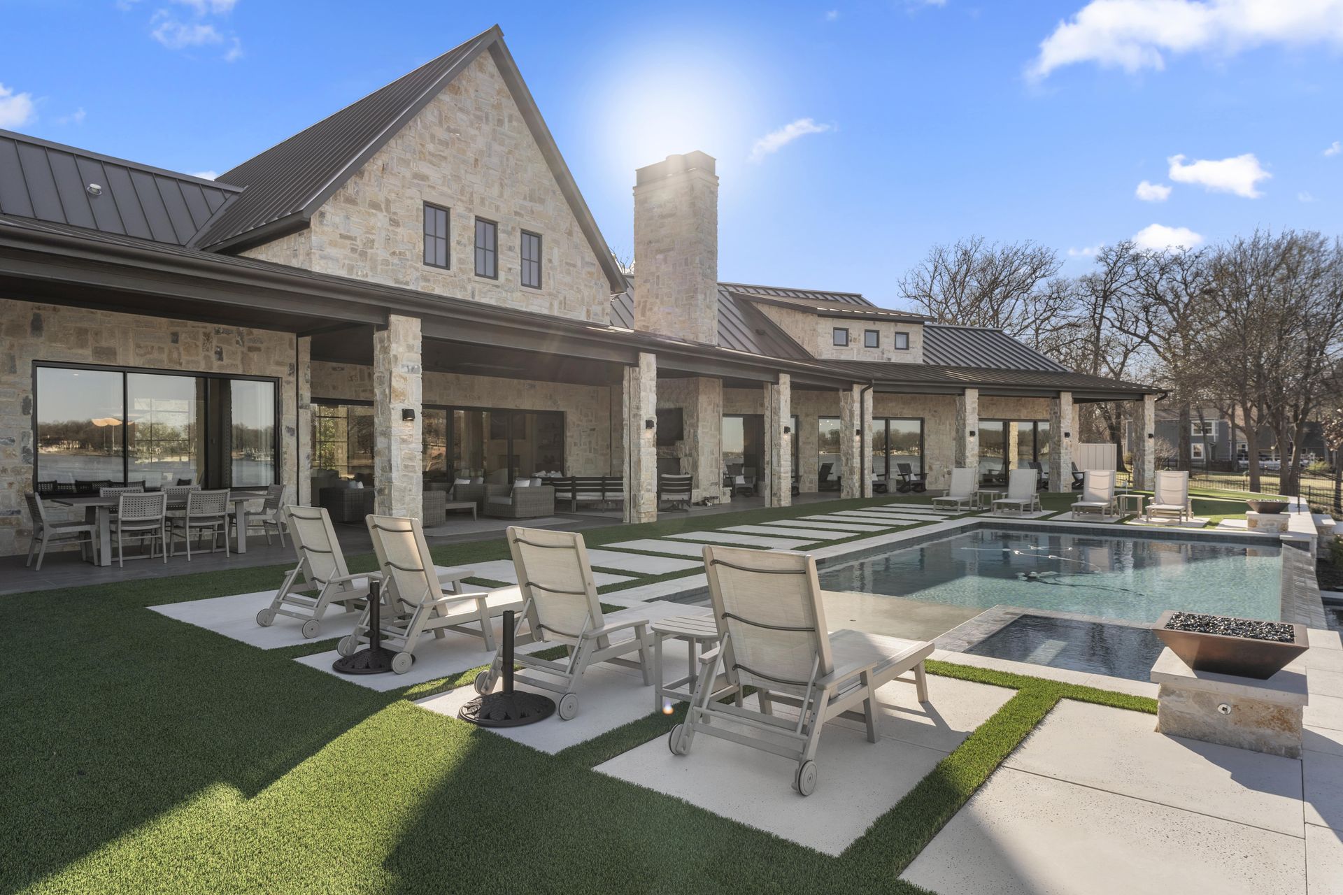 A large house with a large swimming pool in the backyard