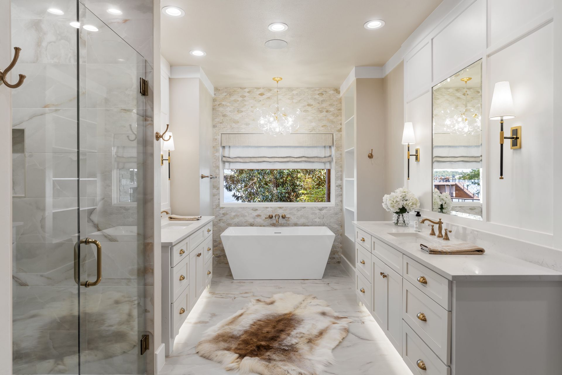 A bathroom with a bathtub , sink , mirror and shower.