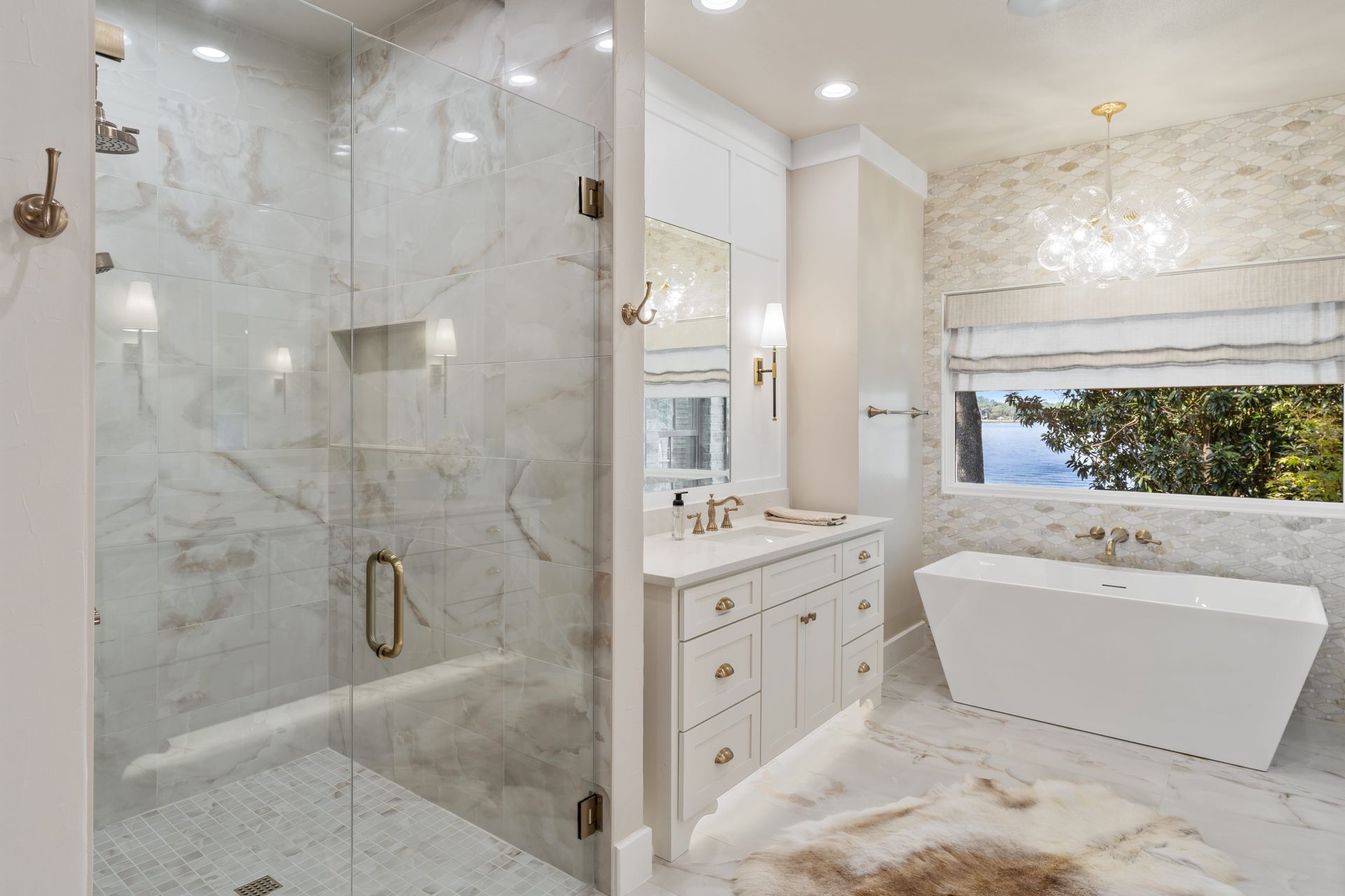 A bathroom with a bathtub , sink , shower and window.