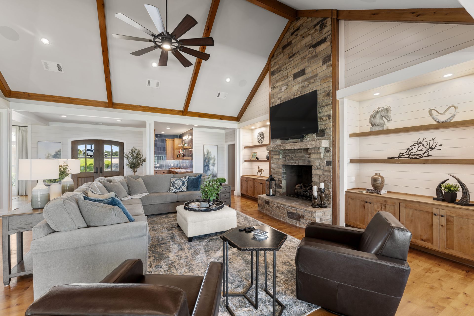 A living room filled with furniture and a fireplace.