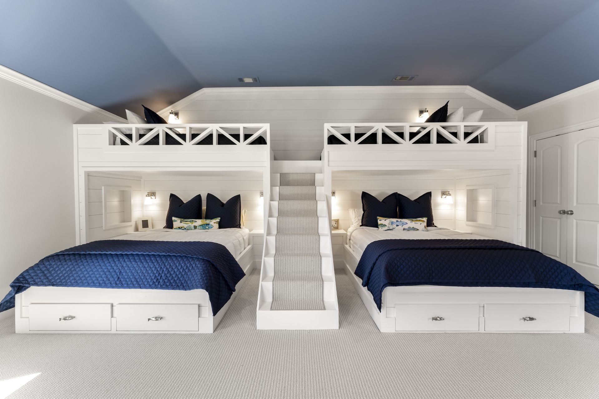 A bedroom with two bunk beds and a slide.