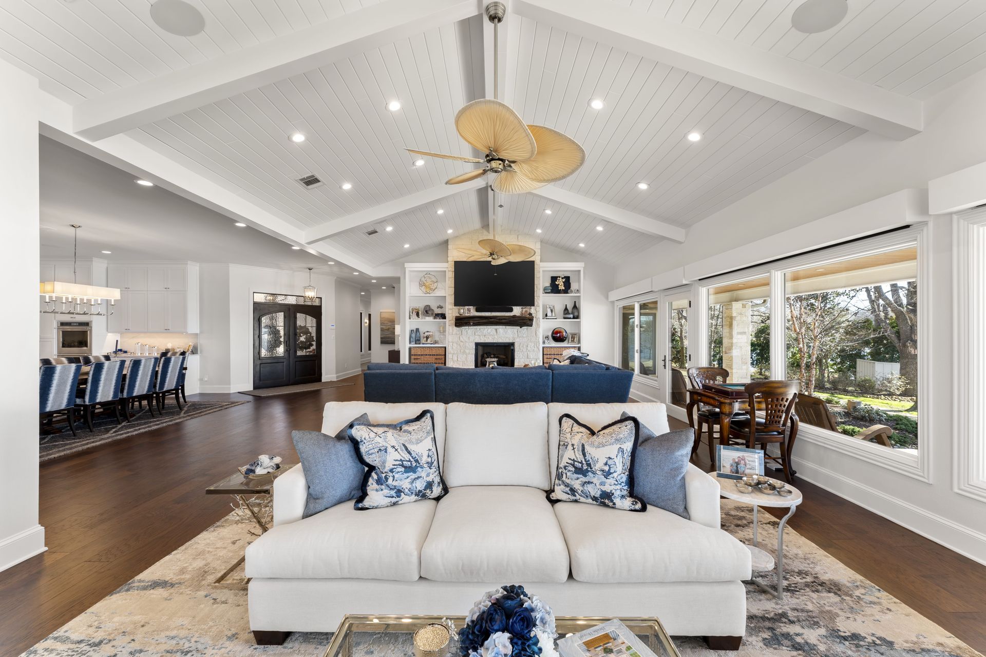 A living room with a couch and a ceiling fan