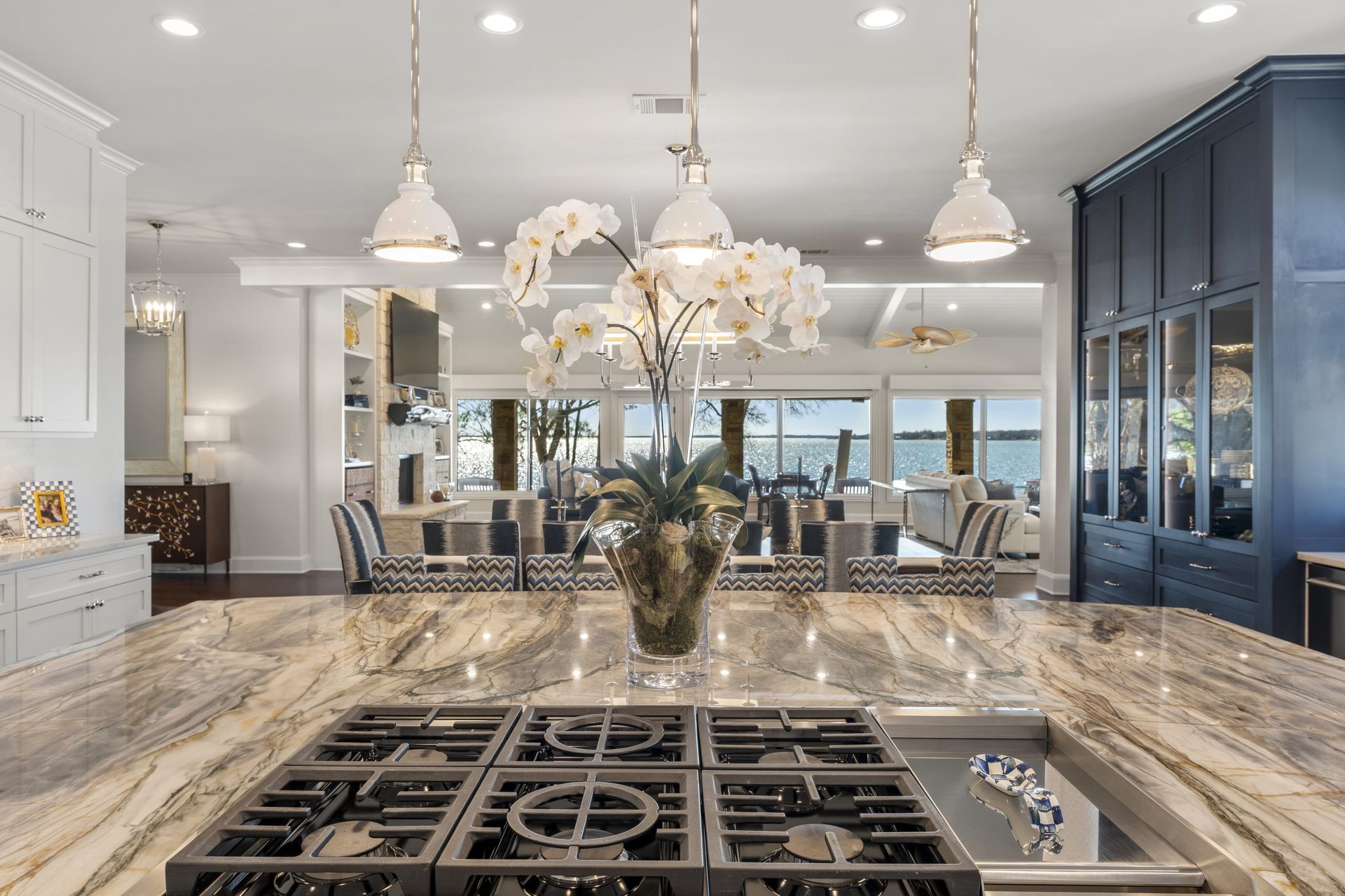 A kitchen with a stove top oven and a sink.