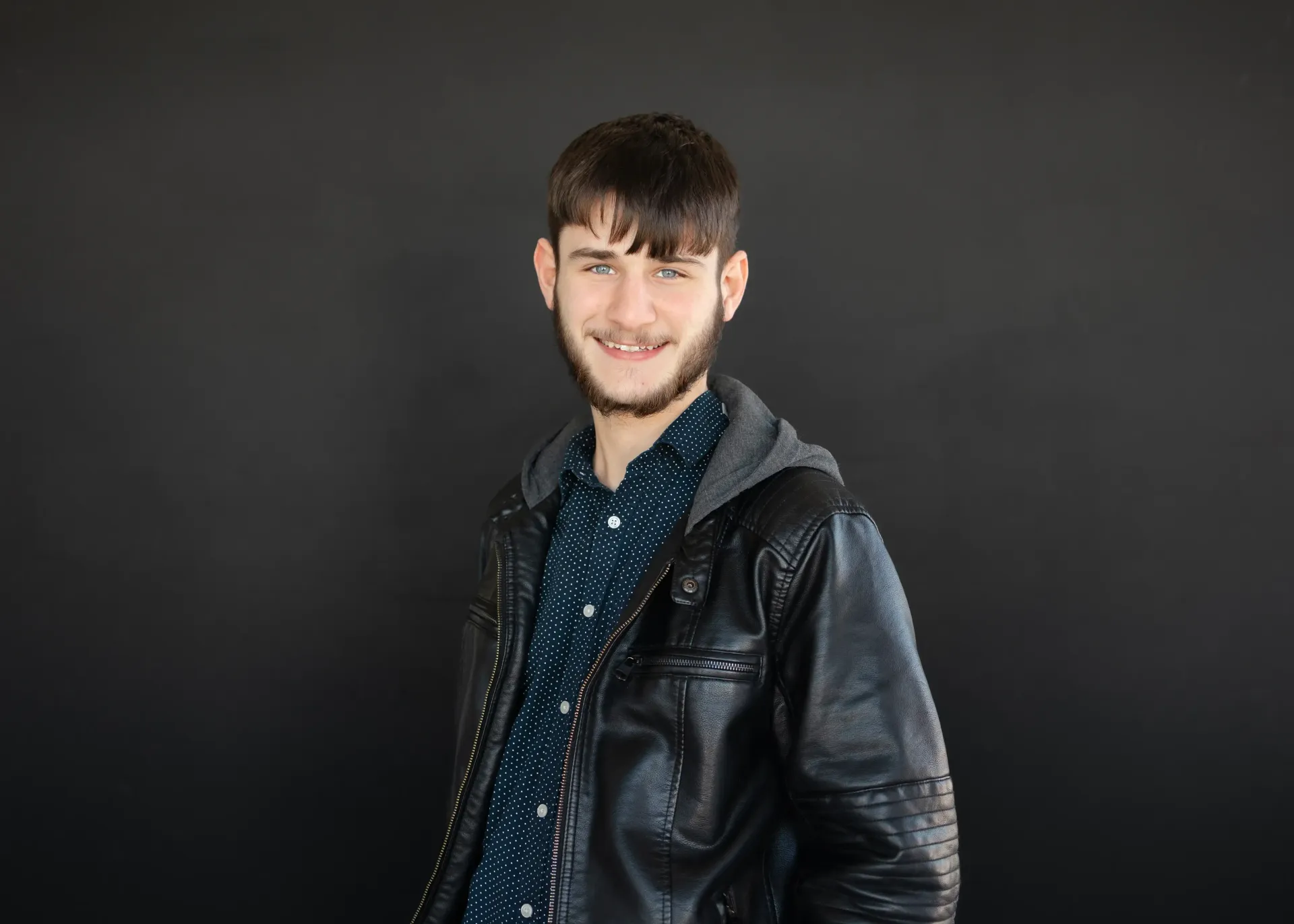 LSM Insurance Agency member with a beard wearing a black leather jacket.