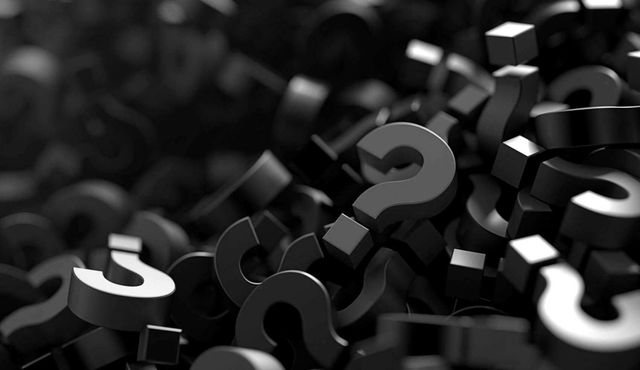Black and white 3D question marks scattered on a dark background