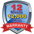 A 12 month 12,000 mile warranty shield with a red ribbon.