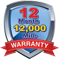 A 12 month 12,000 mile warranty shield with a red ribbon.