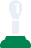 A light bulb is sitting on top of a green base.