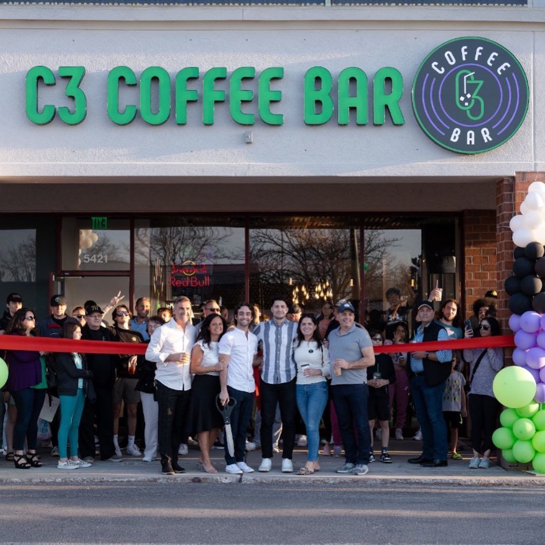 C3 Coffee Bar grand opening: People celebrate with ribbon-cutting. Green and purple accents.