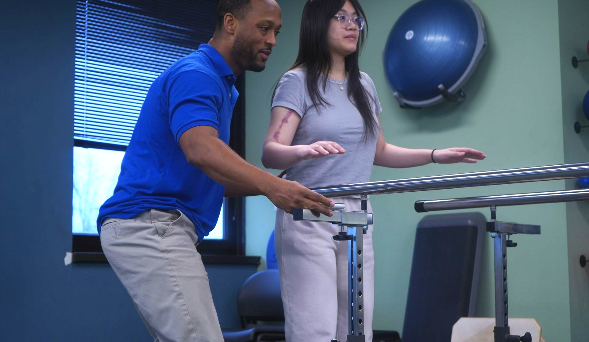Therapist assisting patient during gait training session at AMP Physical Therapy Dunellen NJ.