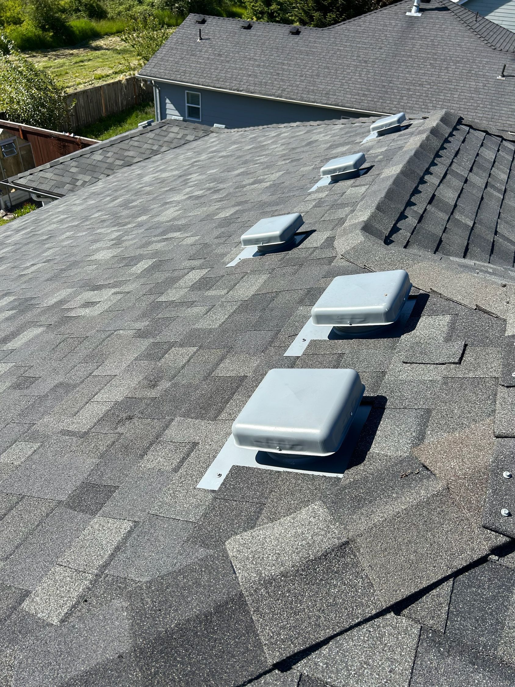 A roof with a lot of vents on it.