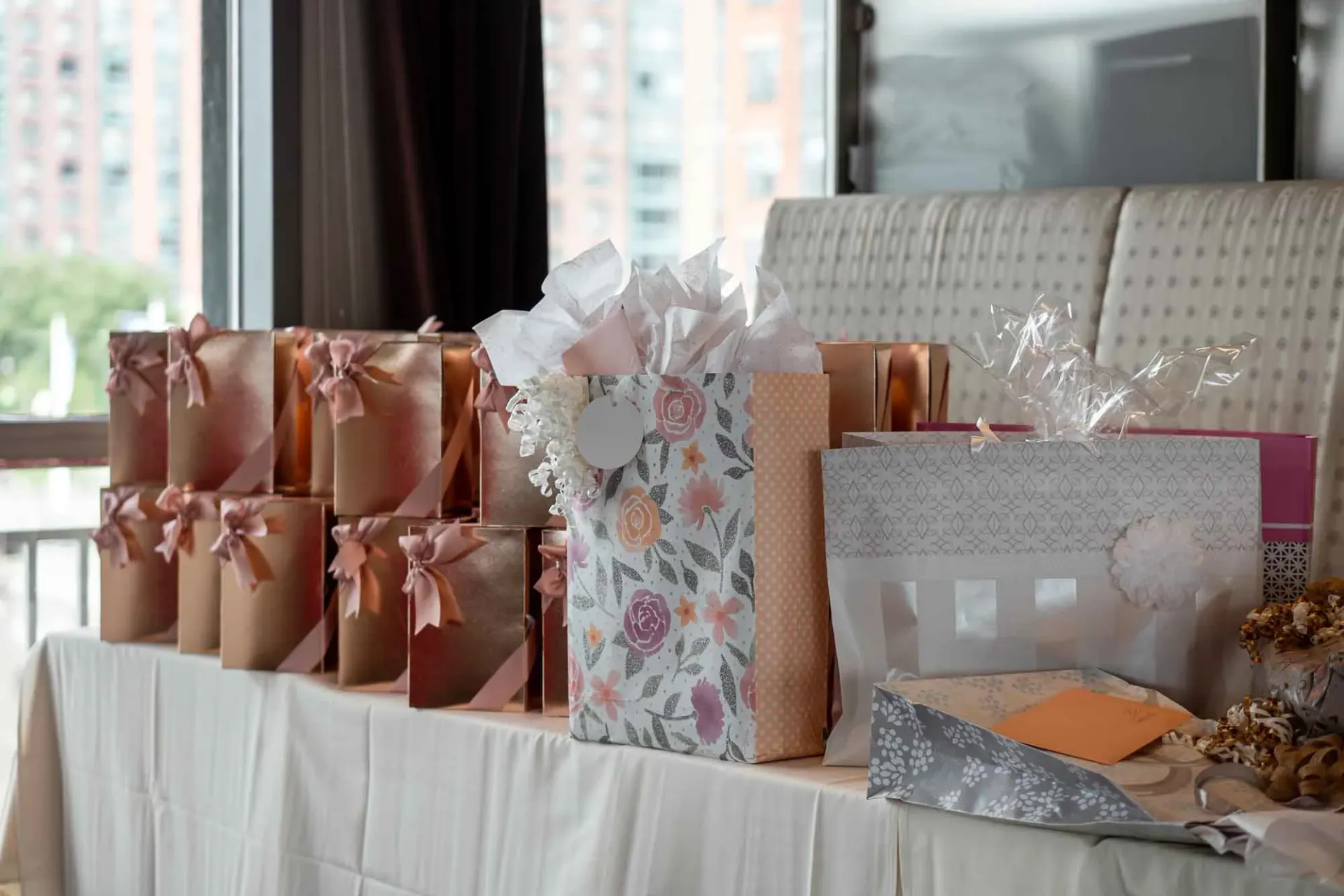 A table with a bunch of gift bags on it