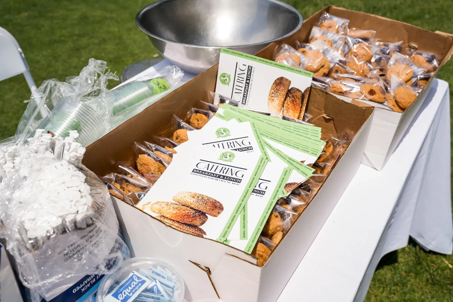 A table with a bunch of boxes of food on it