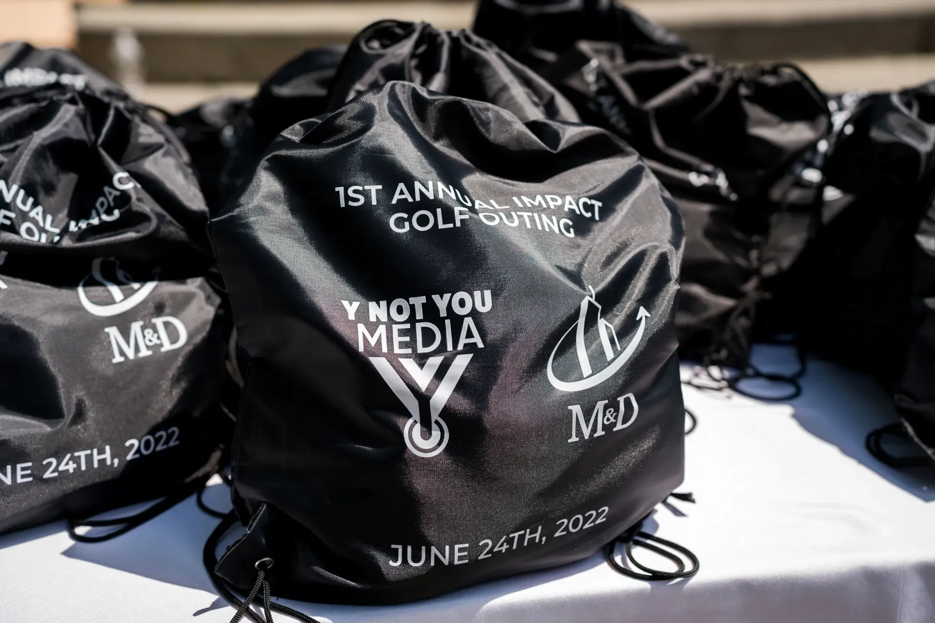 A bunch of black bags with the words i not you media on them