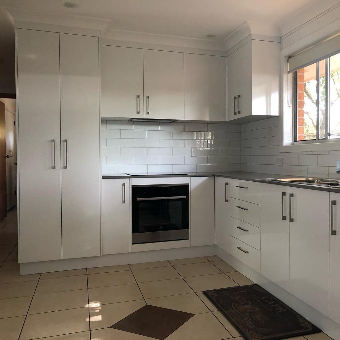 Modern Kitchen With White Custom Cabinets
