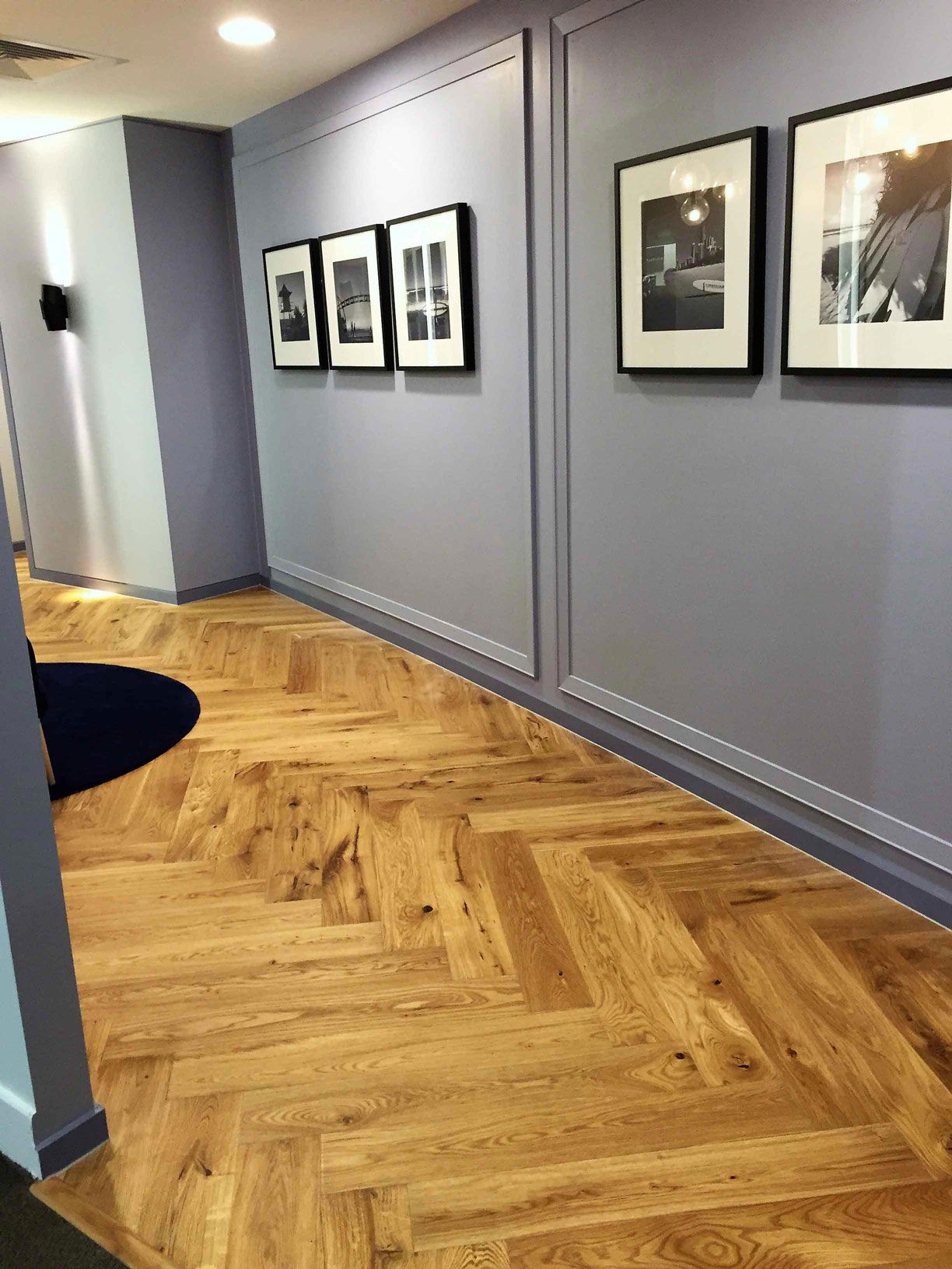 brown floor with violet wall and painting