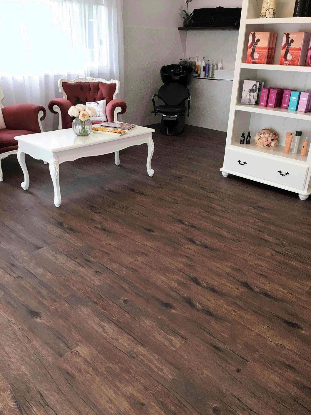 brown floor with white table and cabinet